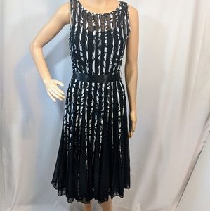 Sleeveless black and white dress with full skirt